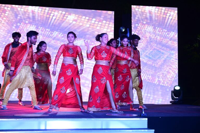 Dance troupe in red on the LED stage, Annual day stagecraft, 2024, organised by OM Events
