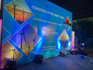 Construction Meet 2024 backdrop with wind turbines, Continuum Green Energy Construction Meet, 2024, organised by OM Events