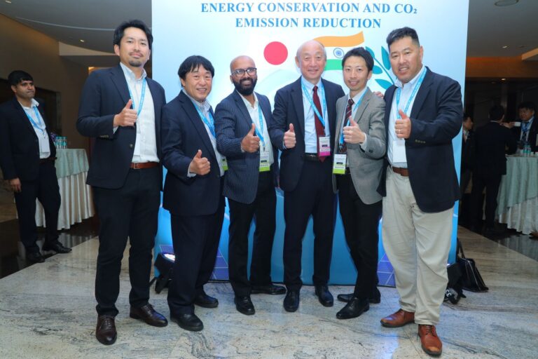 Speakers of an energy conservation forum posing together