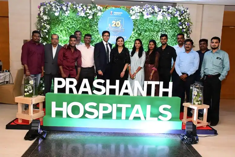Prashanth Hospitals team on a stage set for their 20th anniversary