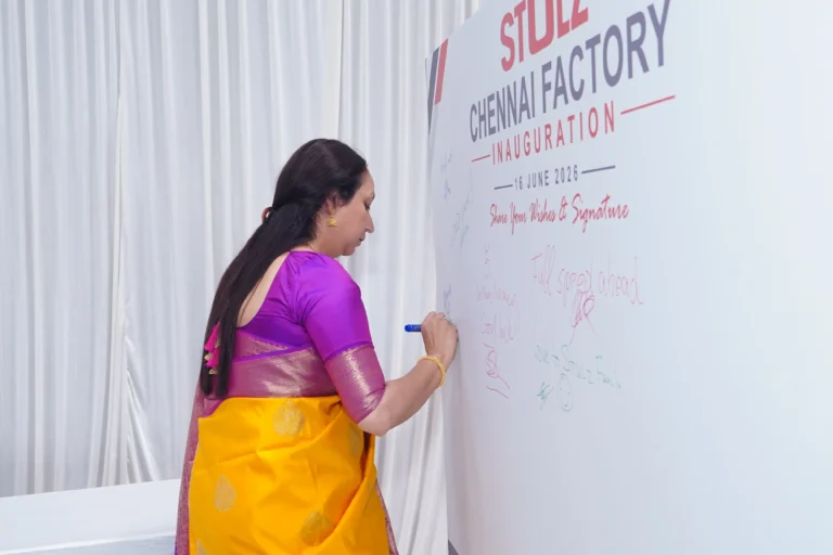 Guest signing the inauguration wall, Stulz Chennai factory inauguration, 2026, organised by OM Events
