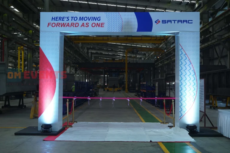 Arch and red carpet on the shop floor before guests arrive, Satrac plant inauguration, 2026, organised by OM Events