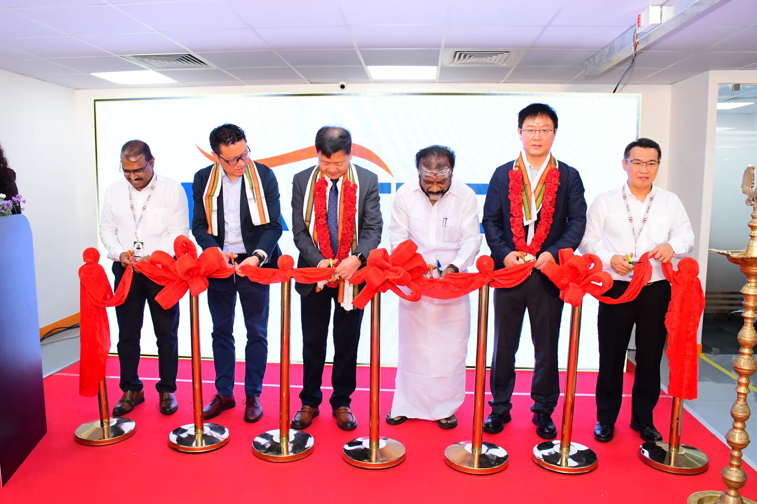 VIP's cutting Ribbon for Office Launch